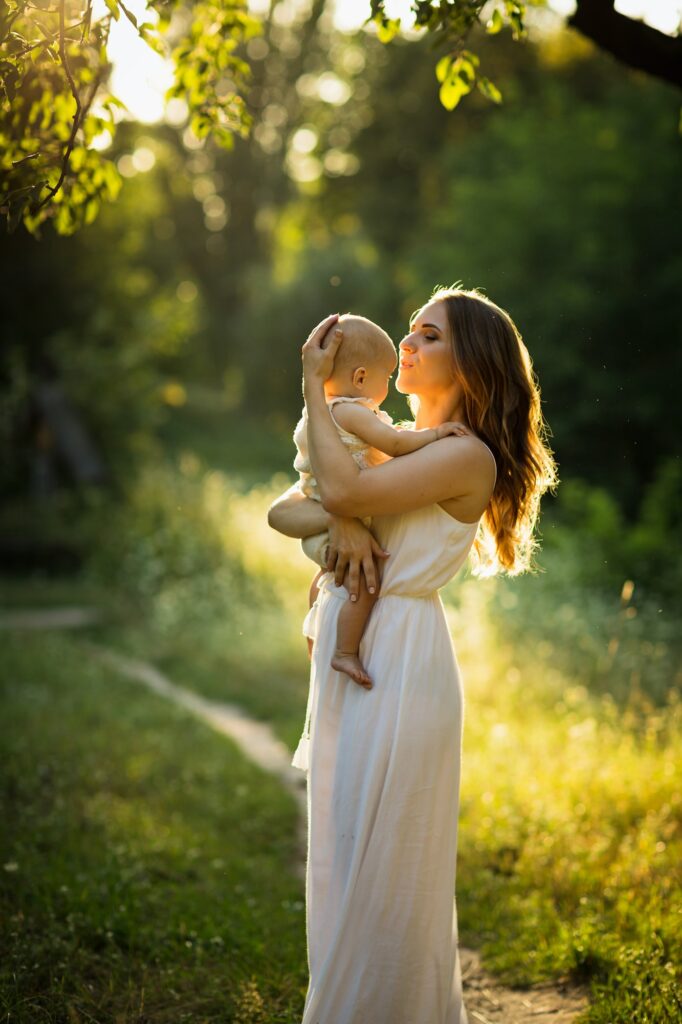 Young beautiful mother plays with her child