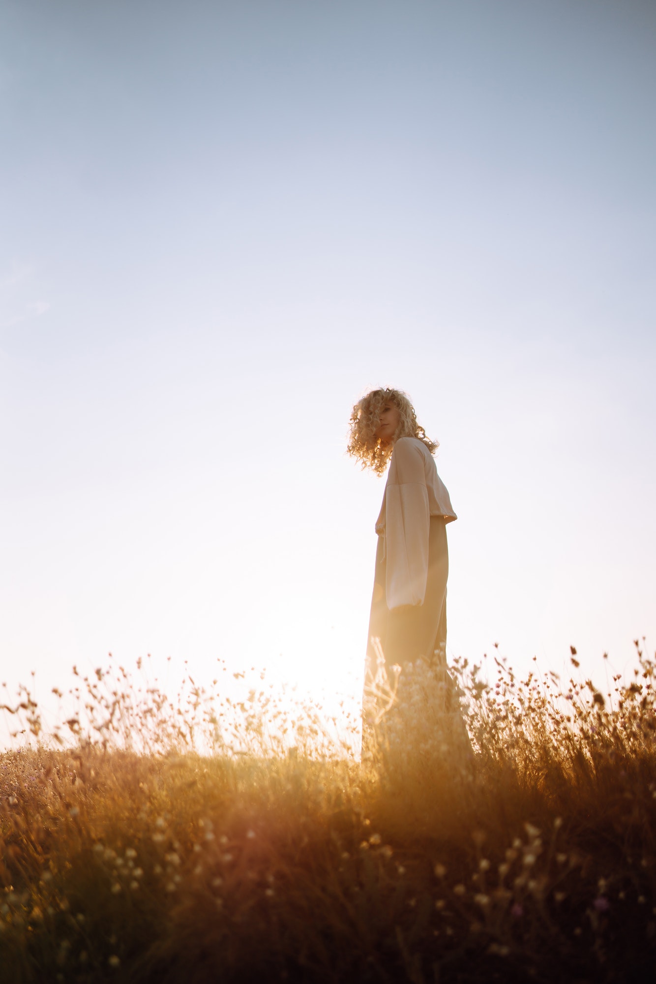 Young woman resting in nature. People, lifestyle, relaxation and vacations concept. Fashion.